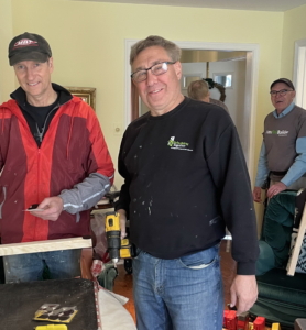 three volunteers working on a project
