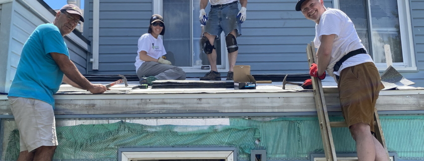 Volunteers working on roof